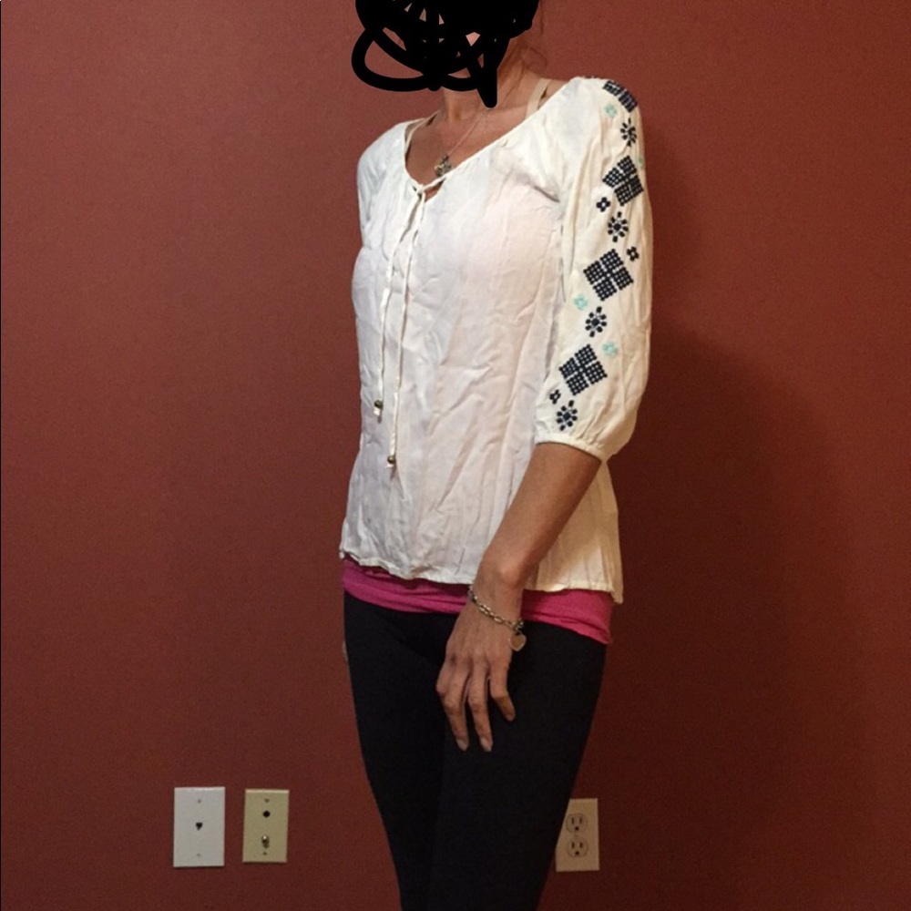 White pullover blouse.